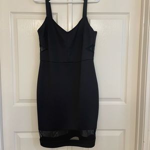 Black knee-length with sheer cut outs/accents